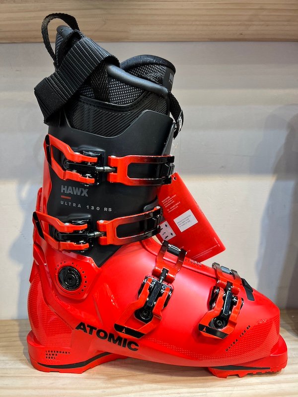 Atomic HAWX Ultra 130 RS ski boots in red. These boots are designed for expert skiers and offer high performance features.