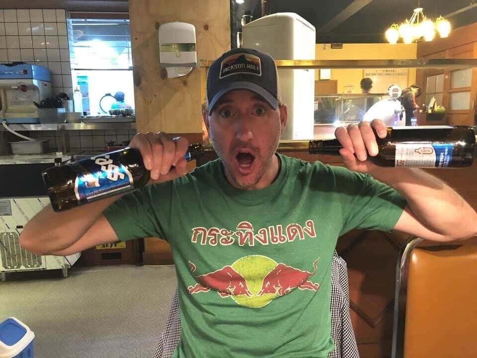 Recognizing Alcohol Abuse Warning Signs: My Journey to Sobriety 32 A heavy long-time drinker is pictured drunk, posing with two beers.
