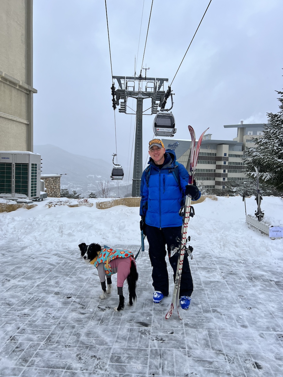 Standing below the gondola at High 1 Resort in ski season. 