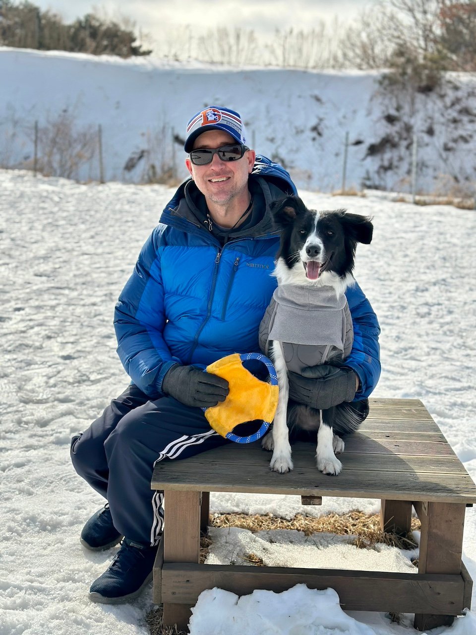 Posing with my border collie at the Soon Su Sheep Ranch in winter.