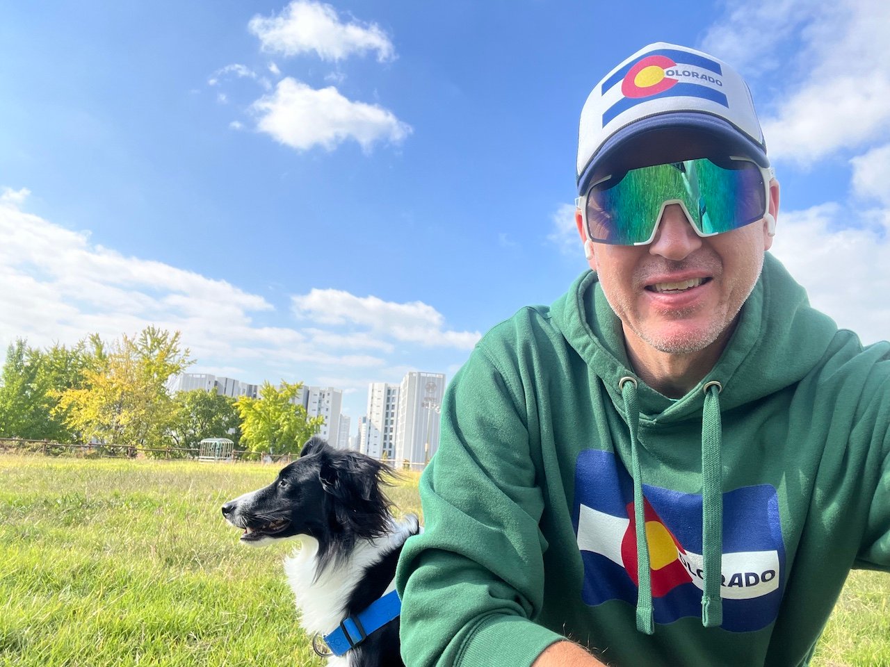 The owner and author of Colorado Saram models the Colorado flag trucker hat and Colorado flag hoodie that are available in the Colorado Saram store. 