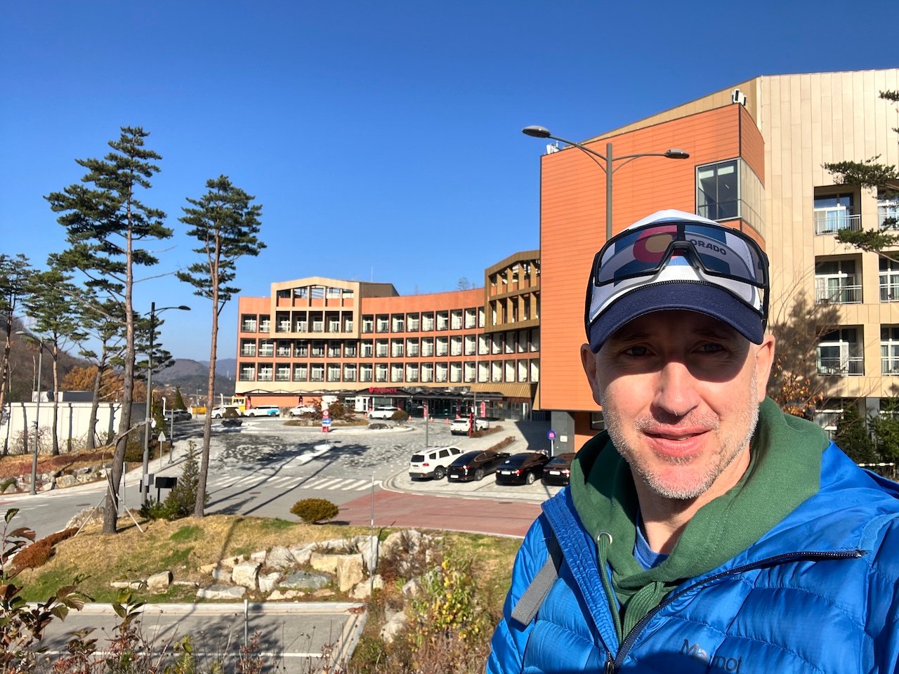 A man stands outside of the Ramada hotel in Pyeongchang, South Korea. The hotel is a short distance from the surrounding ski resorts of Gangwon Province. 