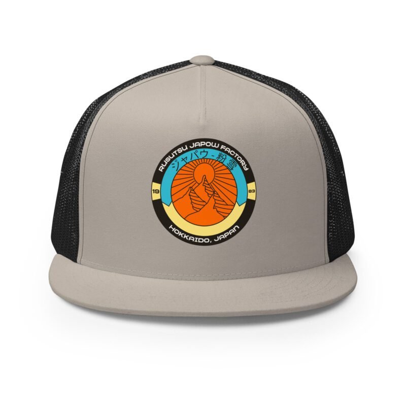 Front view of the Retro Rusutsu Japow Trucker Hat in silver and black – retro ski badge design with mesh back and flat bill