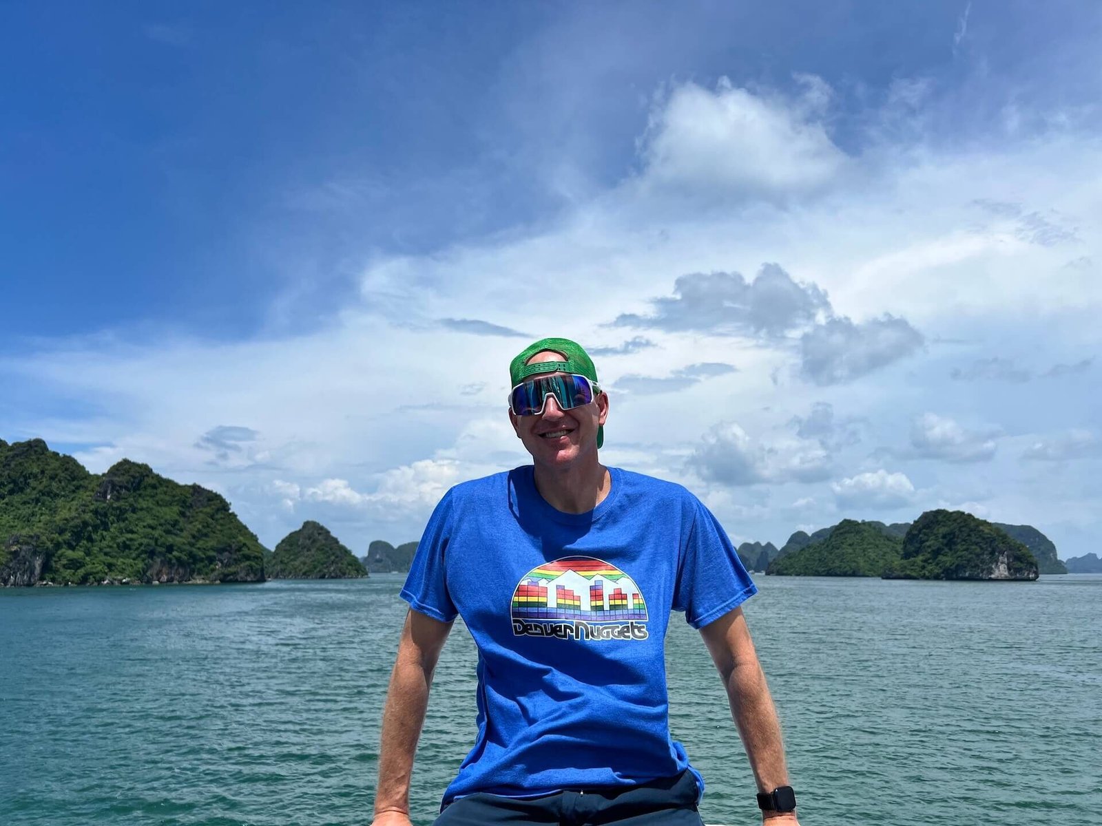 Traveler sailing through Ha Long Bay on a sunny day during Cozy Bay Cruise day tour from Hanoi, Vietnam