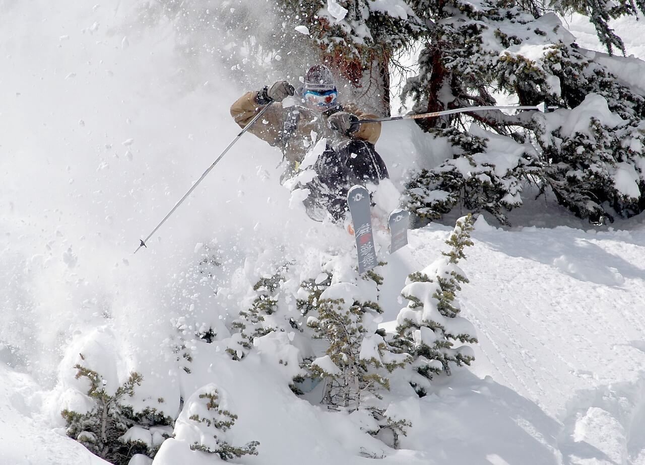 Skier blasting through deep powder in Silverton, Colorado