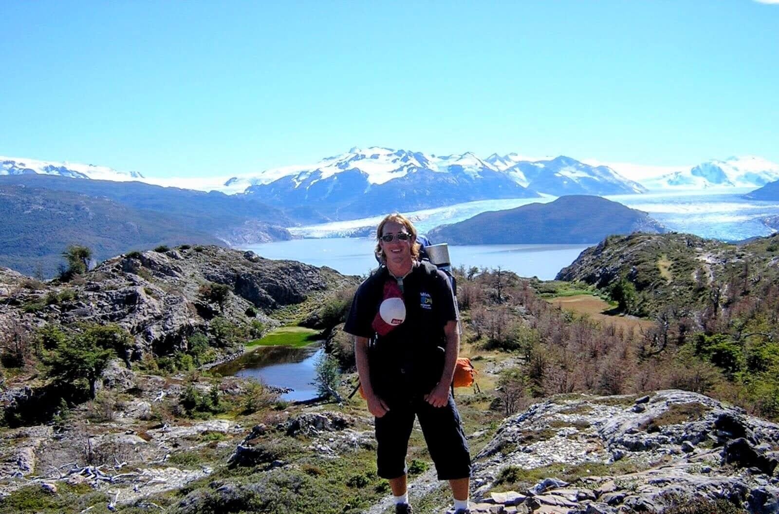 Why Climbing Hallasan in Summer Nearly Broke Me (And What I’d Do Differently) 1 Trekking near glacier in Patagonia with full pack and mountain backdrop