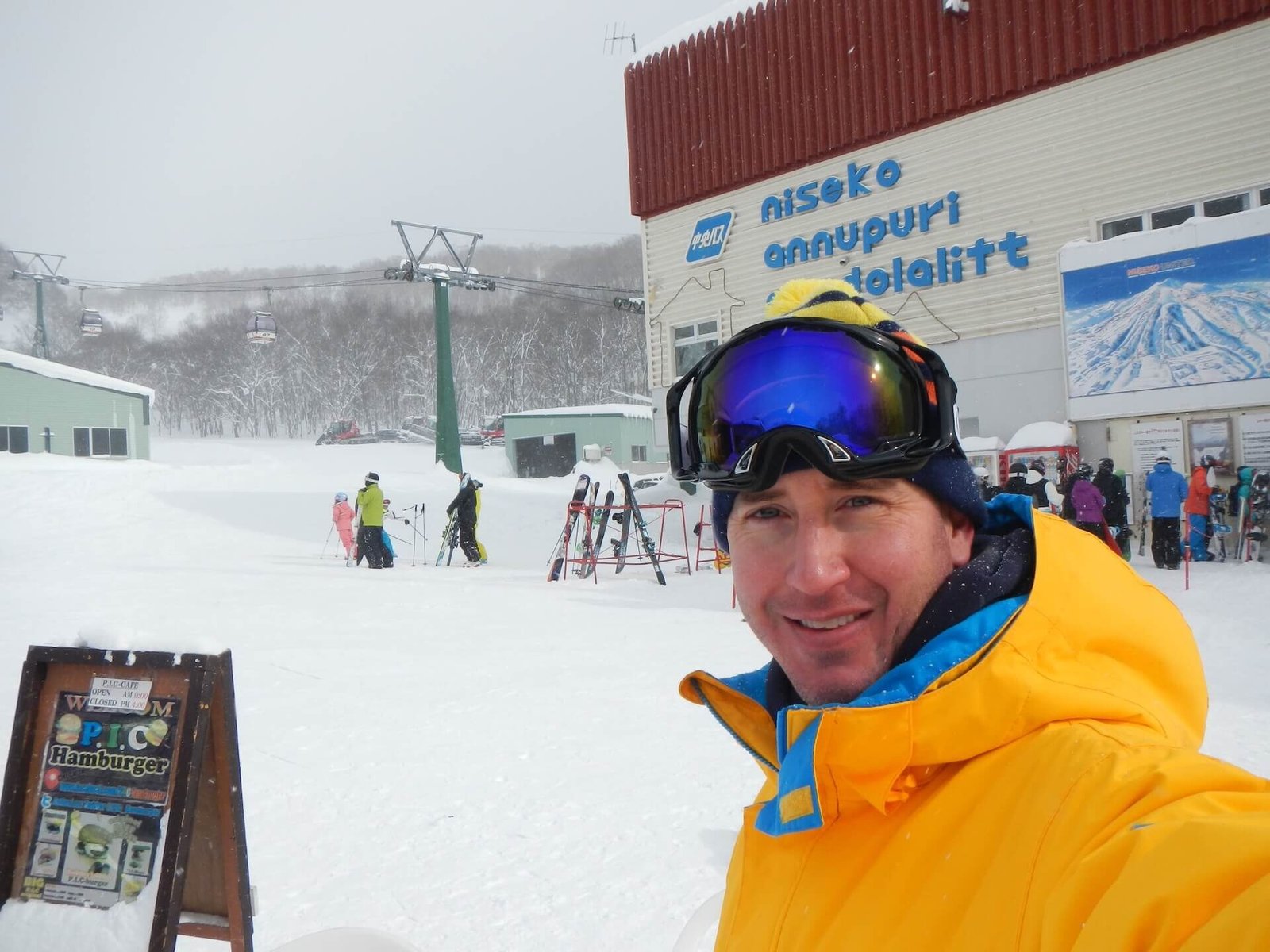 The Perfect 5–7 Day Hokkaido Ski Itinerary (2025 Guide) 1 Skier in yellow jacket at Niseko Annupuri gondola base during solo Japan ski trip in 2014