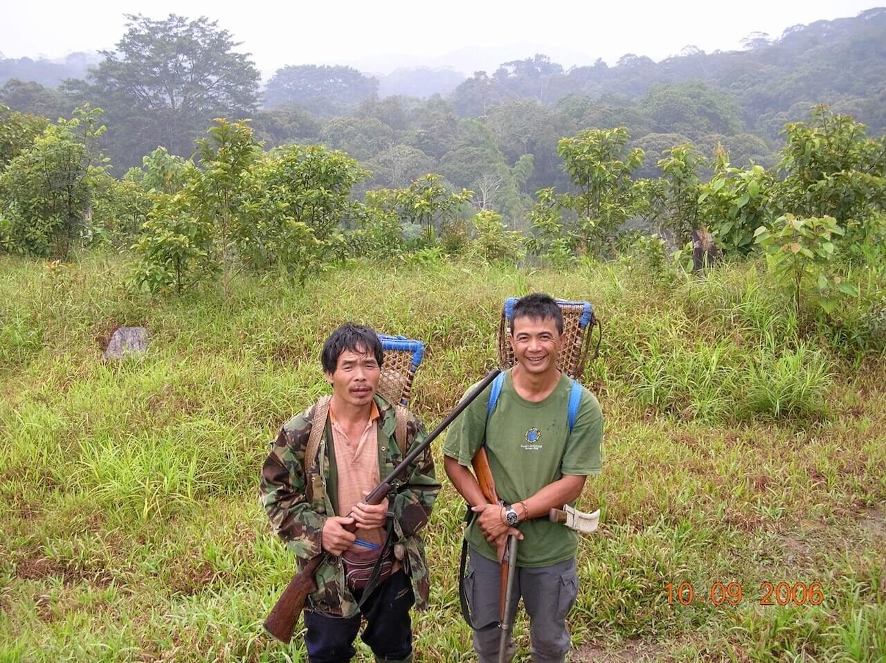 A man trekking with local guides from Kalaw to Inle Lake, Myanmar.