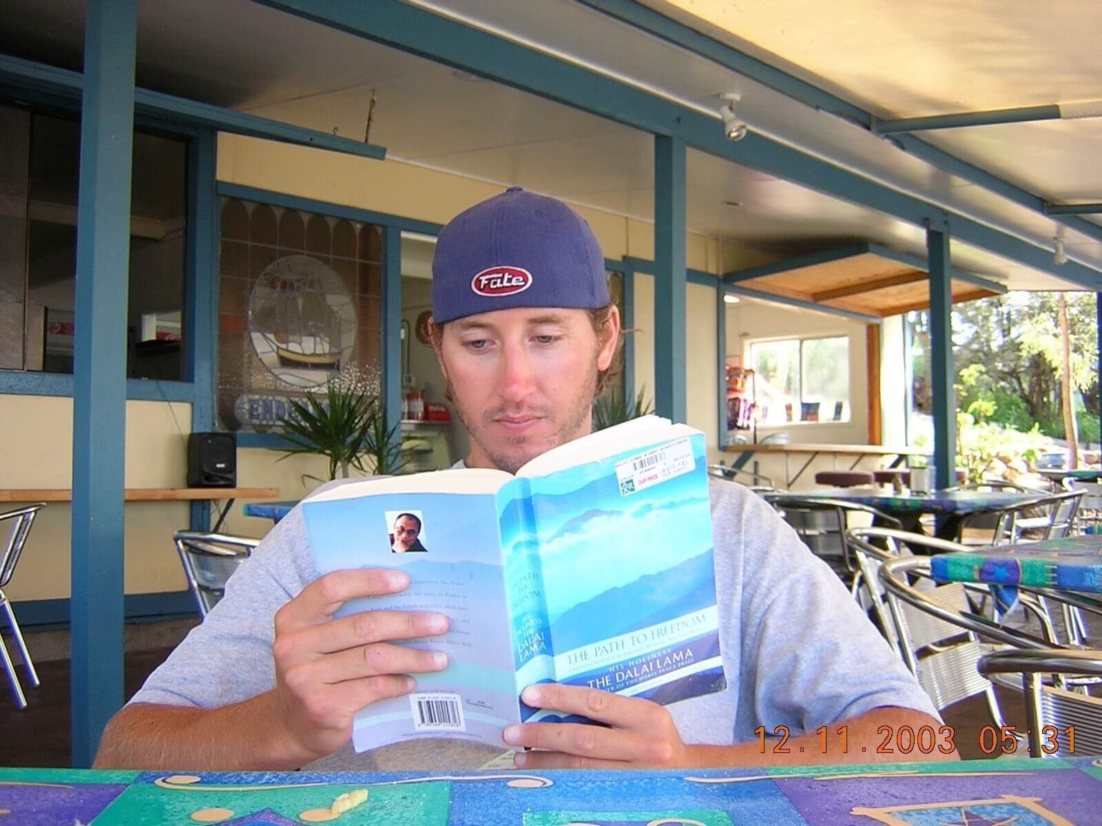 Reading The Path to Freedom by the Dalai Lama at a café in Australia during a year-long backpacking trip in 2003