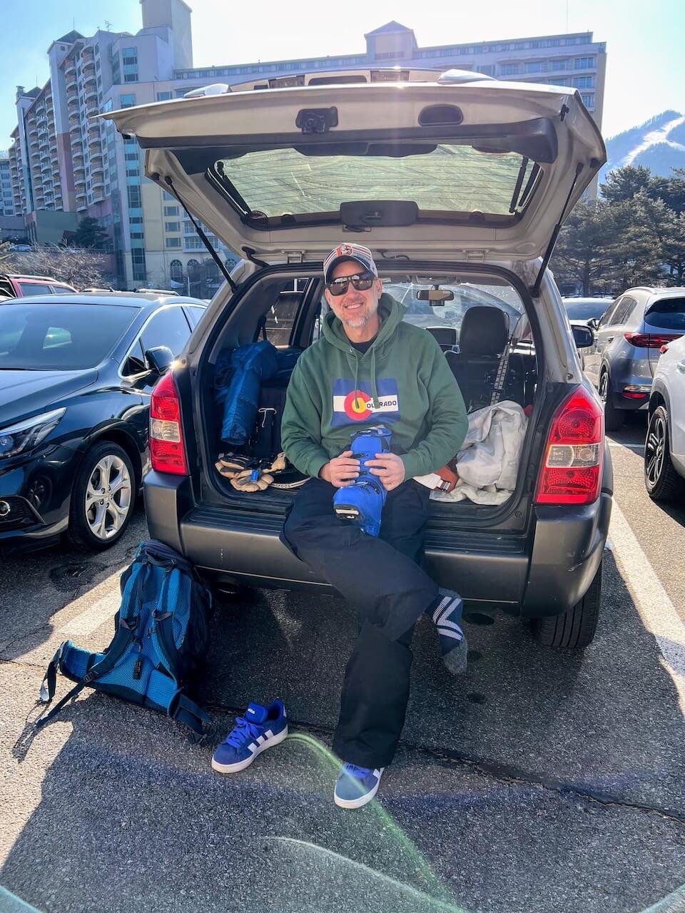 A man gets ready to ski in the parking lot of Welli Hilli Park Resort in South Korea
