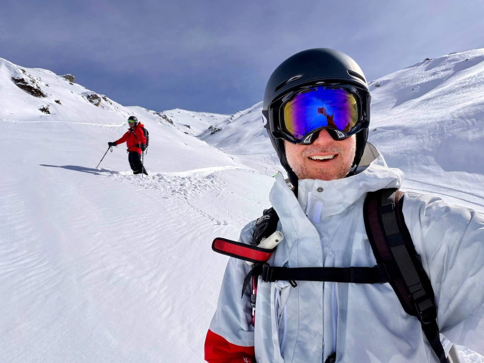 Do You Need a Guide to Ski Gulmarg? 8 Skier following a guide down a gully off Phase 2 in Gulmarg backcountry terrain